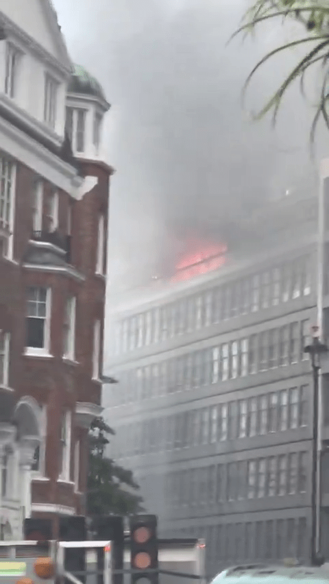 Building fire with smoke.