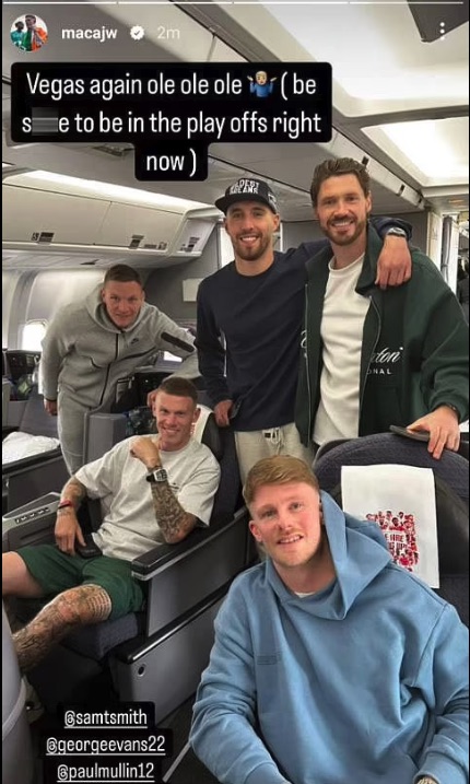 Five men on a plane, celebrating making the playoffs.