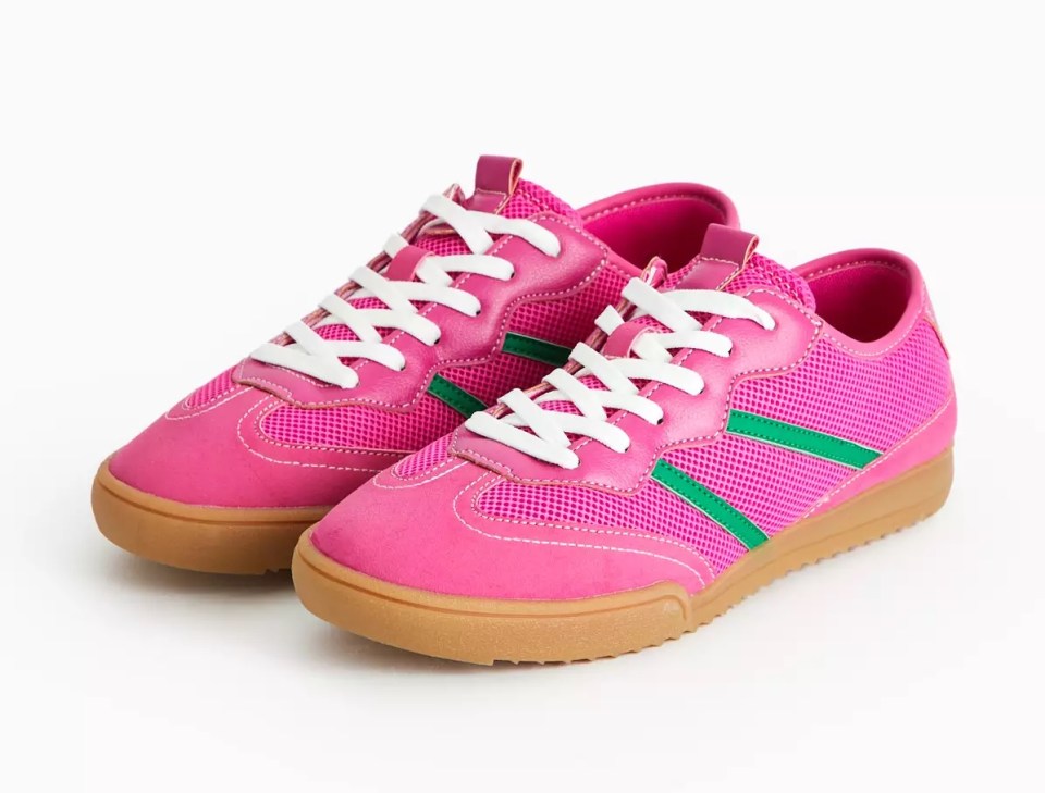Pair of pink sneakers with green stripes.