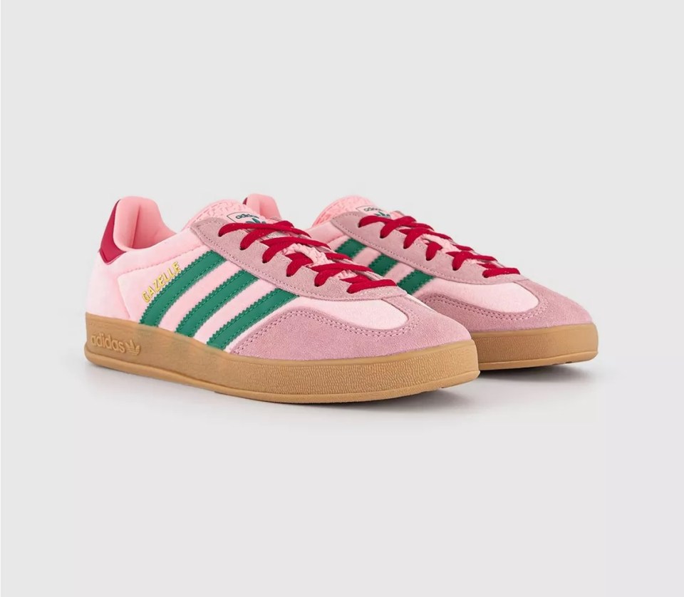 Pink Adidas Gazelle sneakers with green stripes and red laces.