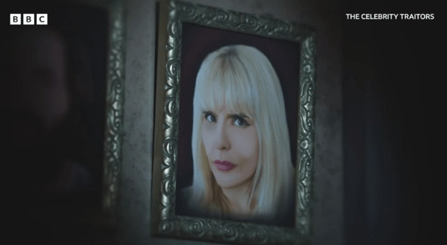 Framed portrait of a blonde woman from *The Celebrity Traitors*.