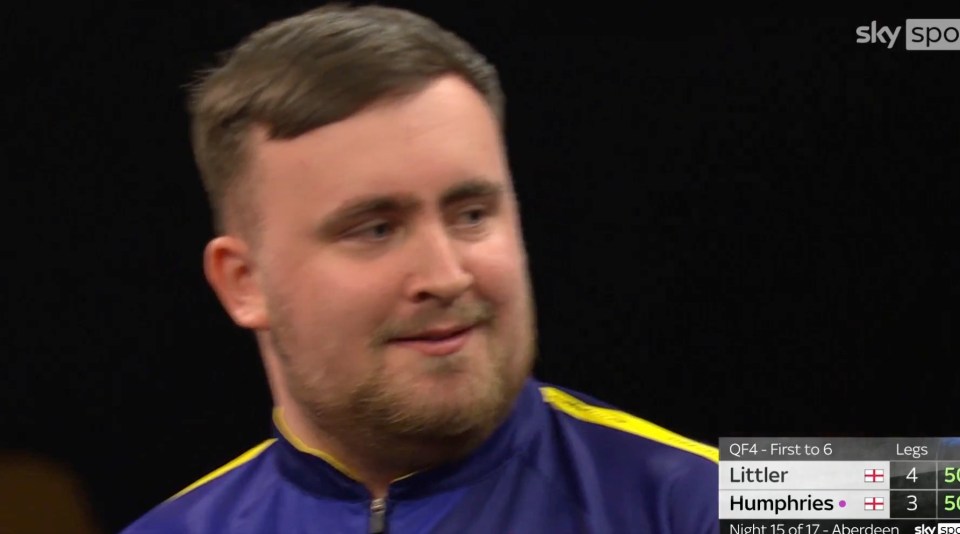 Close-up of a man, possibly a darts player, with a scoreboard showing Littler 4-3 Humphries.