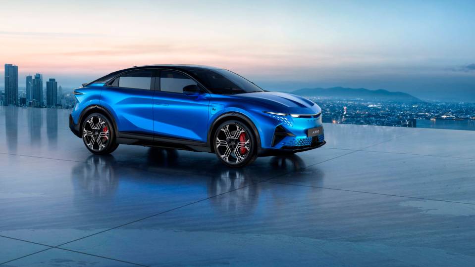 Blue Alpine A390 electric SUV parked on a rooftop overlooking a city.