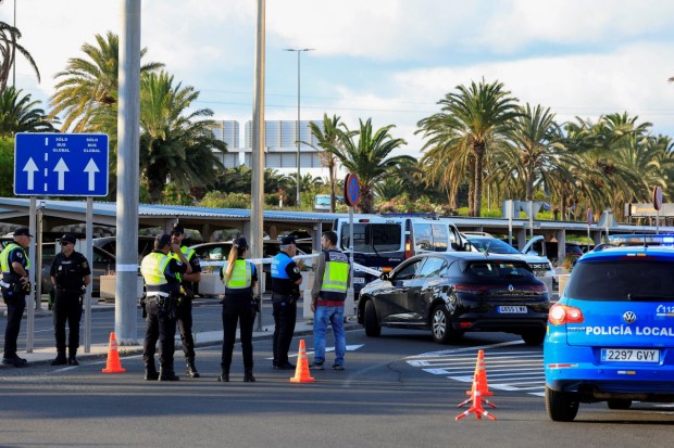 Spanish National Police officers at Gran Canaria Airport following a police shooting.