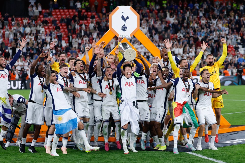 Tottenham Hotspur's South Korean forward #07 Son Heung-min raises the trophy as he celebrates with teammates winning the UEFA Europa League final football match between Tottenham Hotspur and Manchester United at San Mames stadium in Bilbao on May 21, 2025. (Photo by Thomas COEX / AFP) (Photo by THOMAS COEX/AFP via Getty Images)