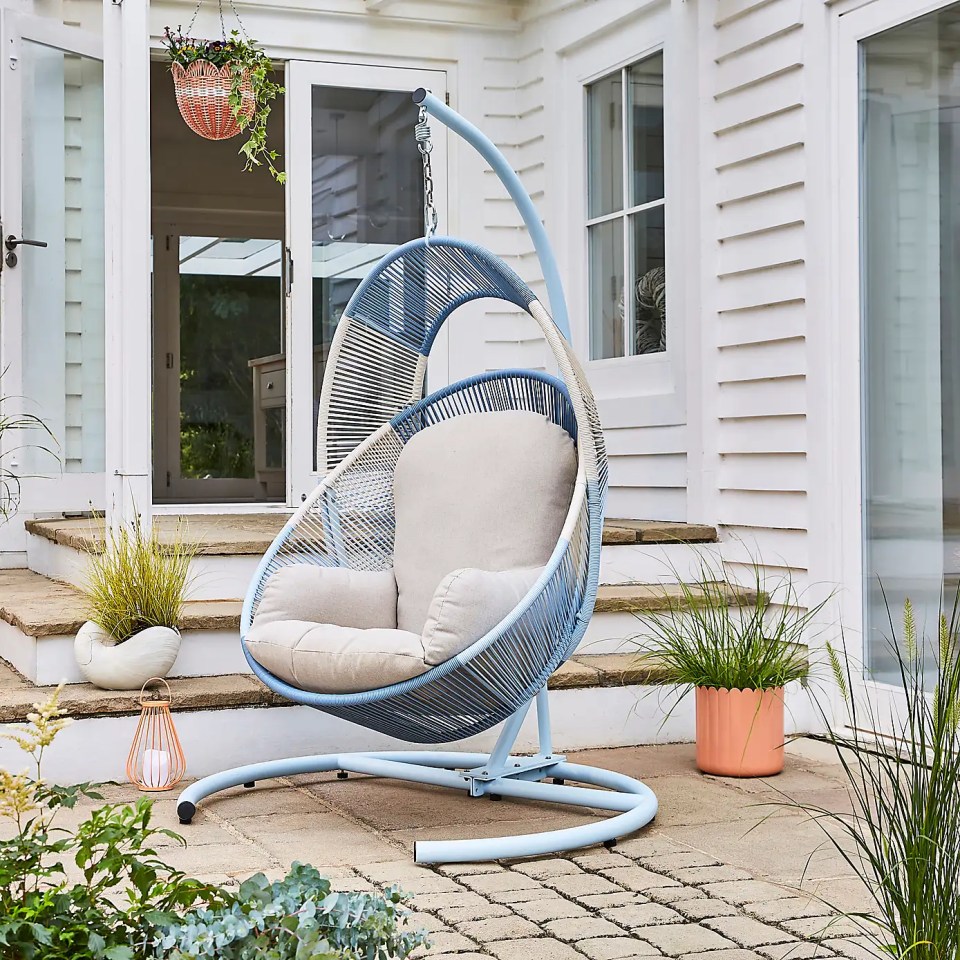 Blue and white egg chair on patio.