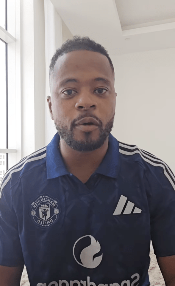 Man in a Manchester United jersey.