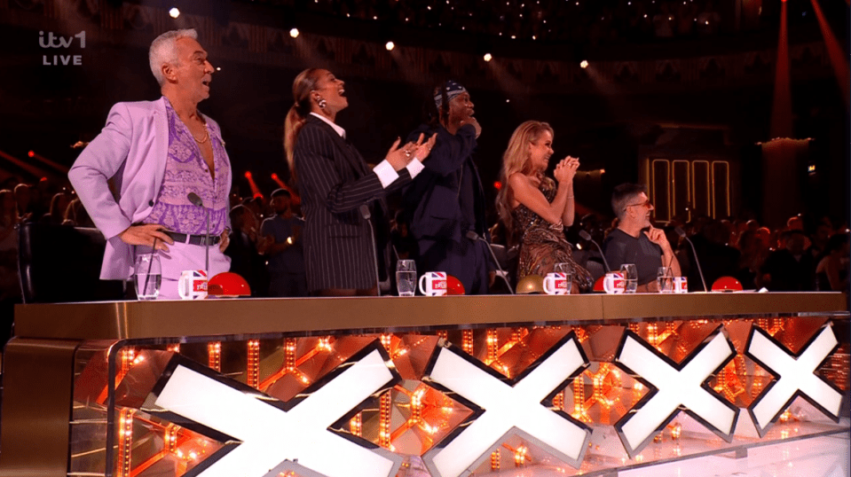 Screenshot of four judges at the X Factor judging panel.