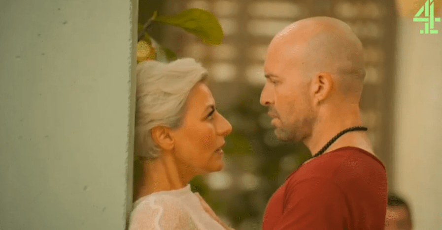 Screenshot of a man and woman facing each other.