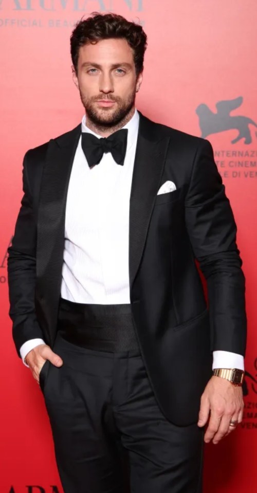 Man in tuxedo at an awards ceremony.