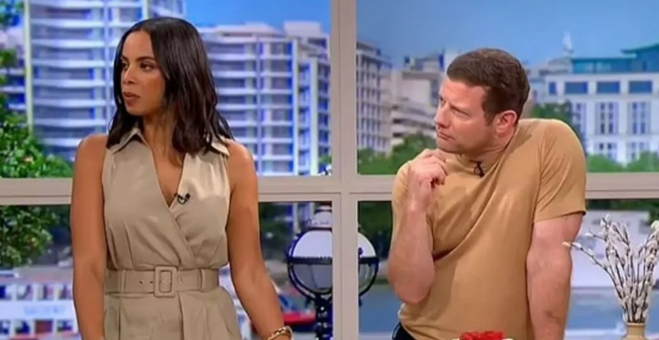 Two people on a morning show discussing a raspberry pavlova.