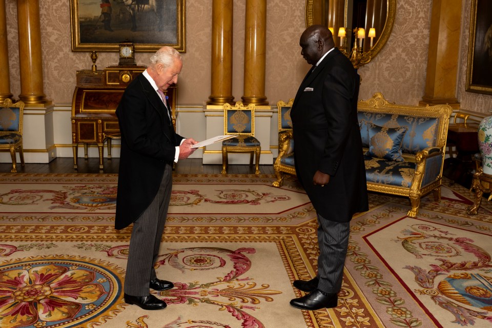 King Charles III receiving credentials from the South Sudanese ambassador at Buckingham Palace.
