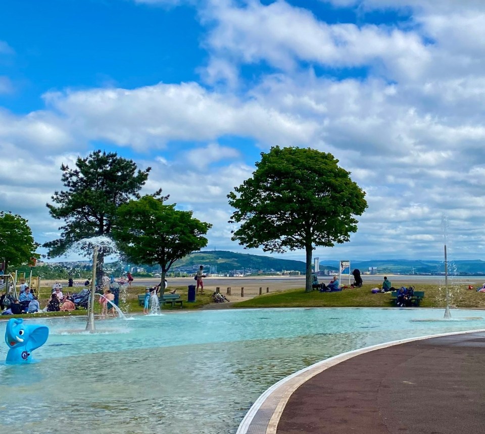 Blackpill Lido, Swansea with people enjoying the water features.