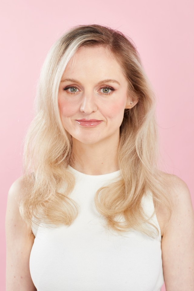 Woman with blonde hair wearing a white tank top.