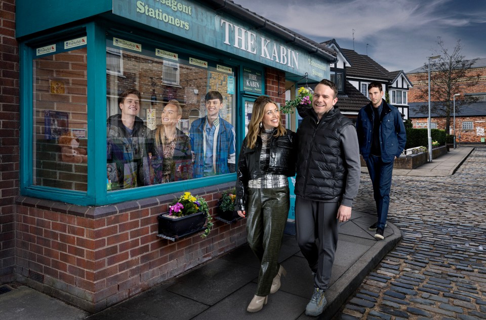 Photo of Coronation Street actors walking past a shop.