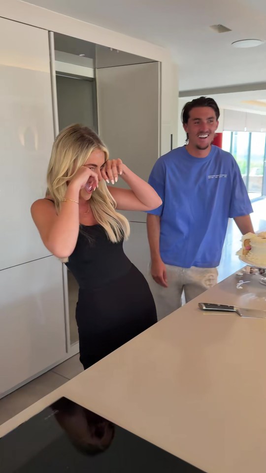 Claudia Fogarty and a man react joyfully to the news that they are having a baby girl.