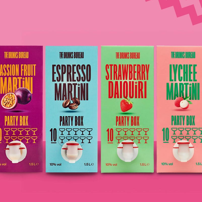 Four cocktail party boxes: passion fruit martini, espresso martini, strawberry daiquiri, and lychee martini.