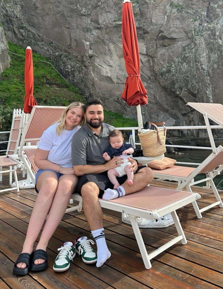 Couple on vacation with their baby.