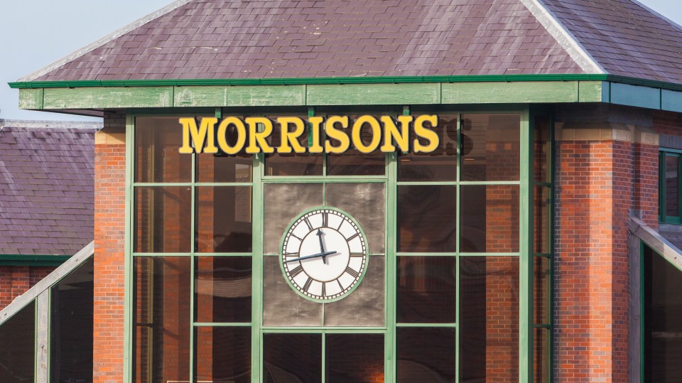 Morrisons supermarket exterior with clock.