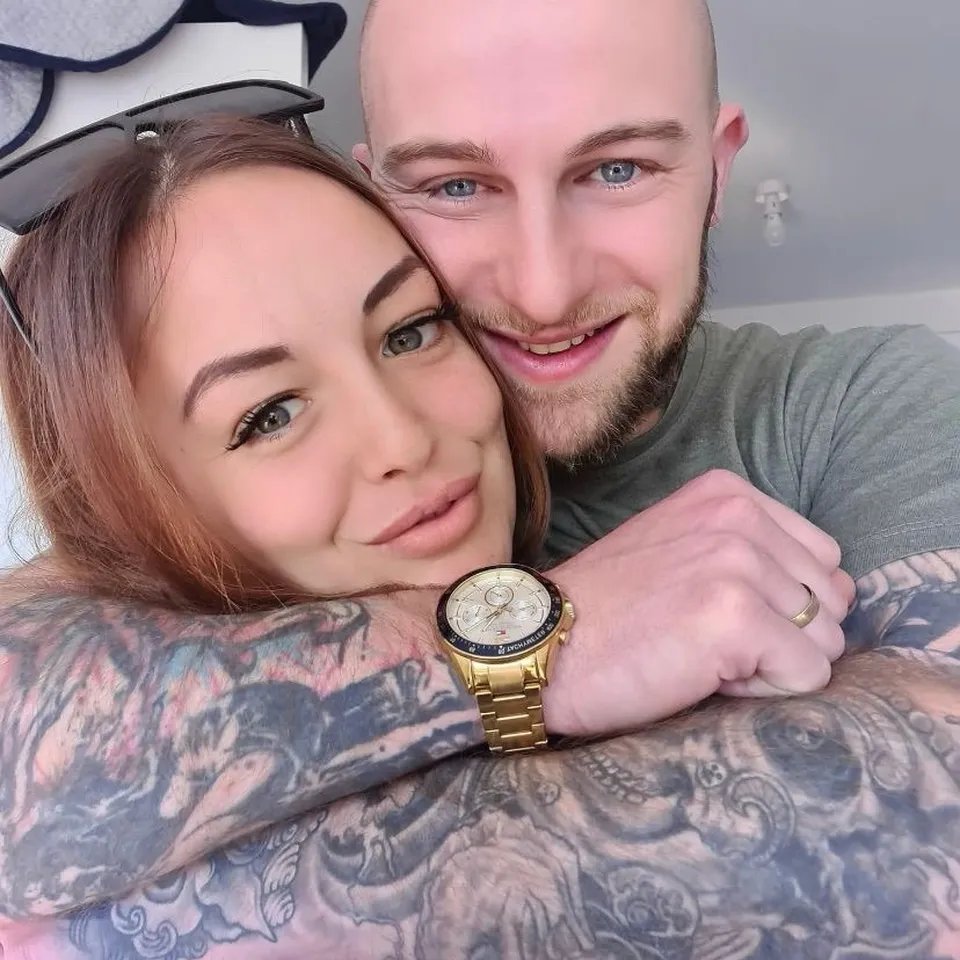A photo of a couple embracing.