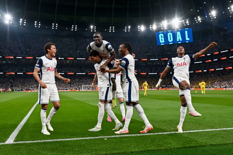 Tottenham Hotspur players celebrating a goal.