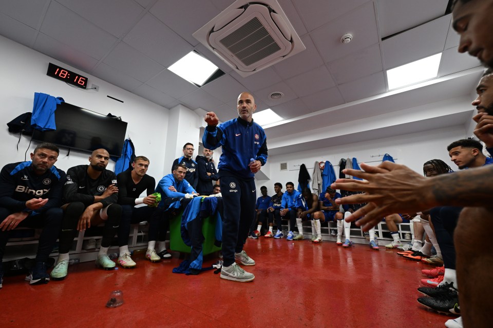 Chelsea's manager Enzo Maresca speaks to his players in the locker room.