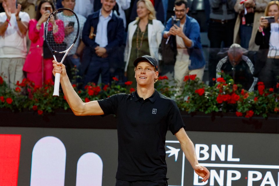 Jannik Sinner of Italy celebrates a tennis match victory.