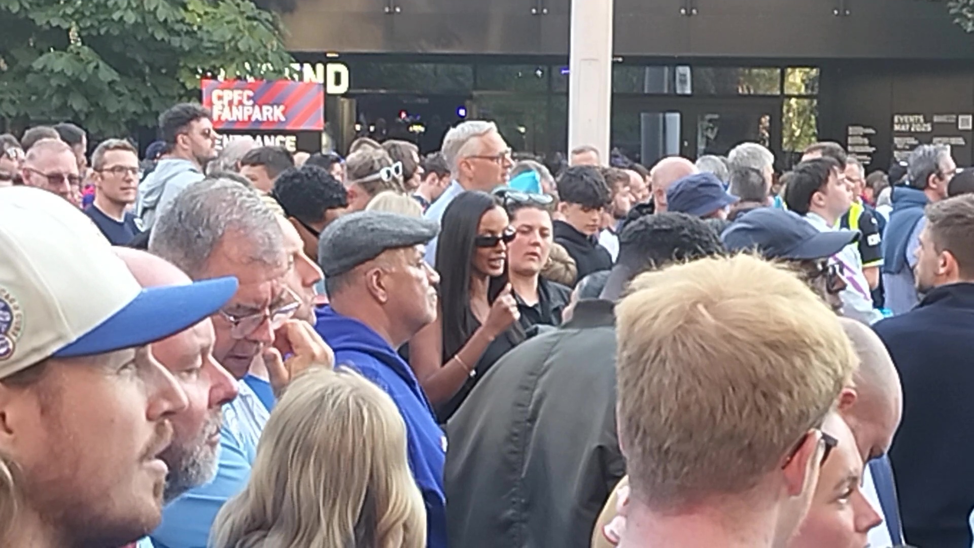 Maya Jama in a crowd of people.