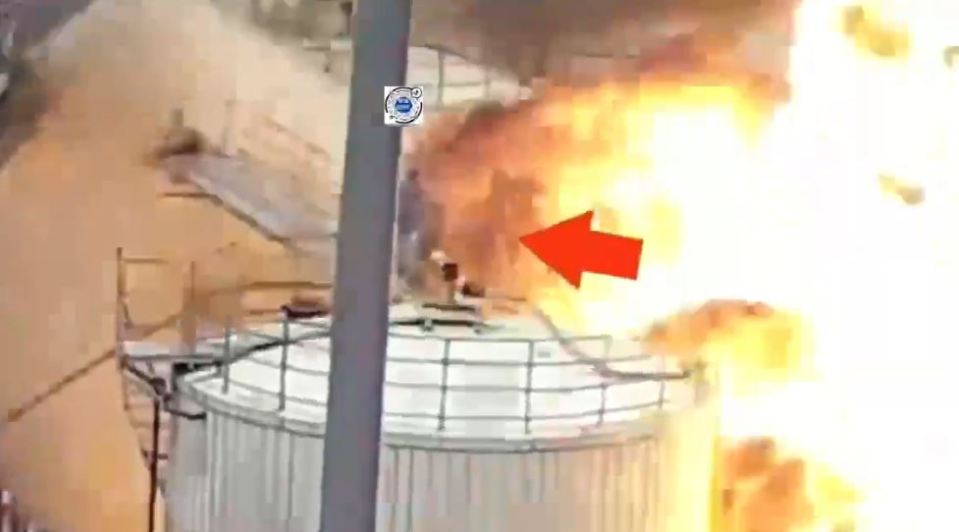 Large fire engulfing an industrial tank.