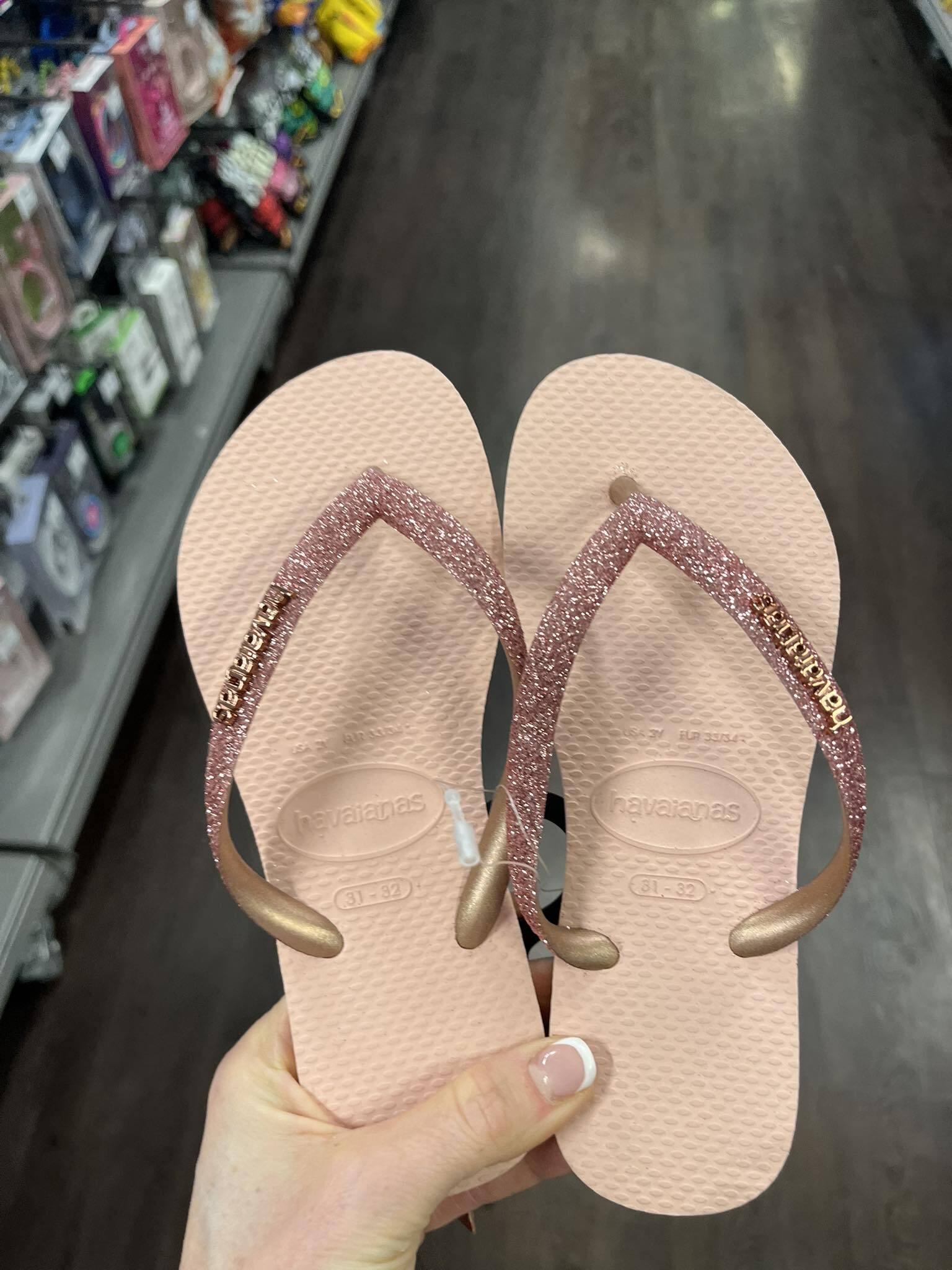 Pair of pink glitter Havainas flip-flops.