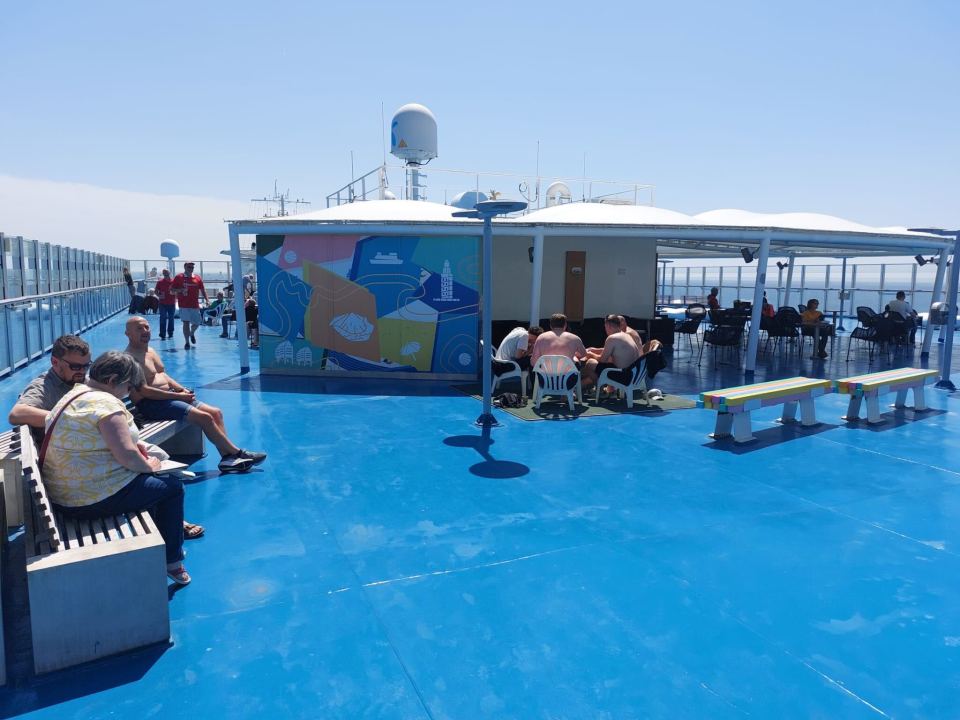 Passengers relaxing on the deck of a ferry from Portsmouth to Bilbao.