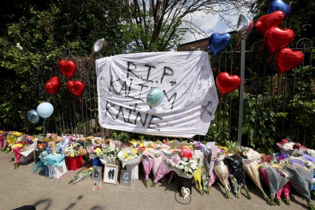 Floral tributes and messages for Kai and Kane.
