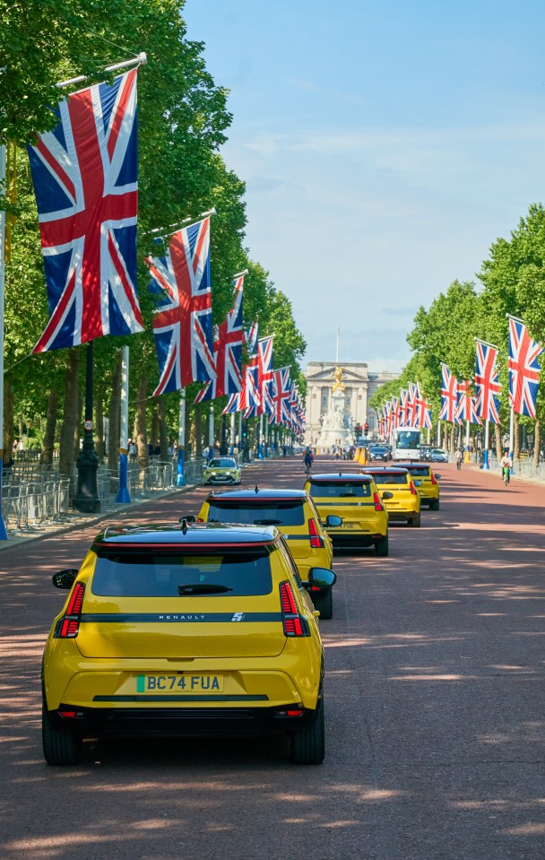 Five yellow Renault 5 E-Tech Electric cars driving past landmarks in London.