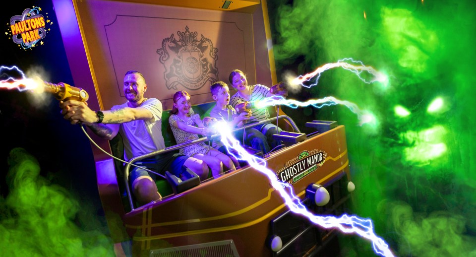 Family riding Ghostly Manor ride at Paultons Park.
