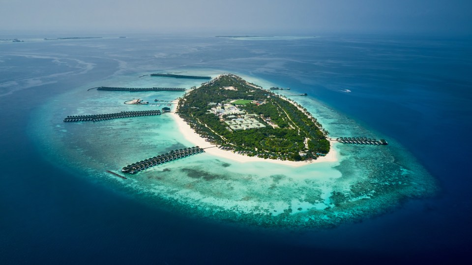 Aerial view of a Maldives resort island.