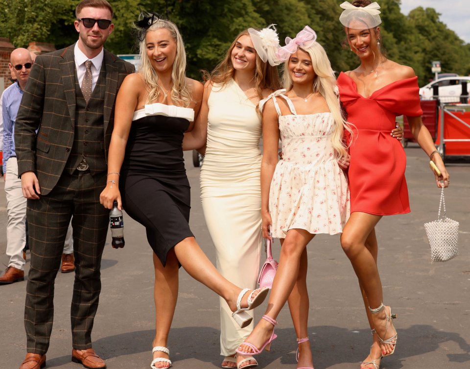 Racegoers at York Races enjoying summer weather.