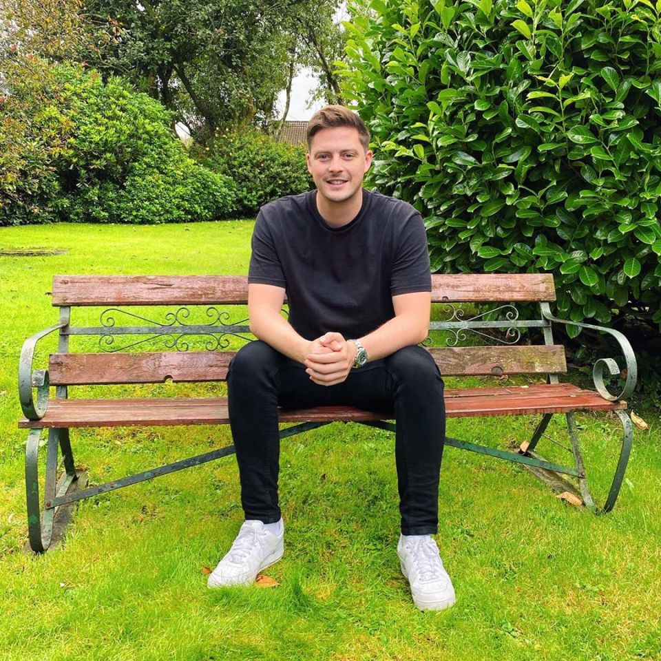 Man sitting on a park bench.
