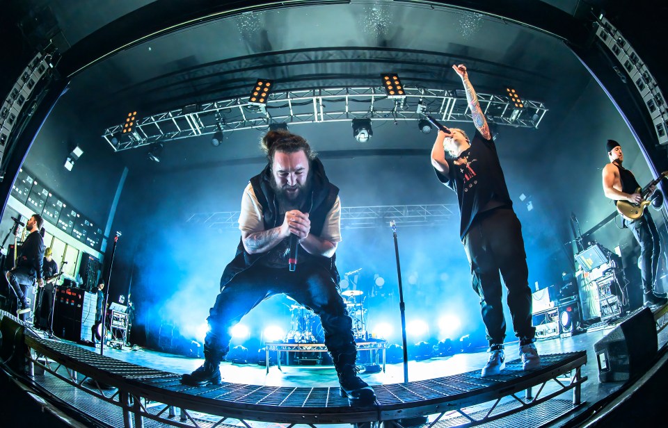 I Prevail performing live on stage.