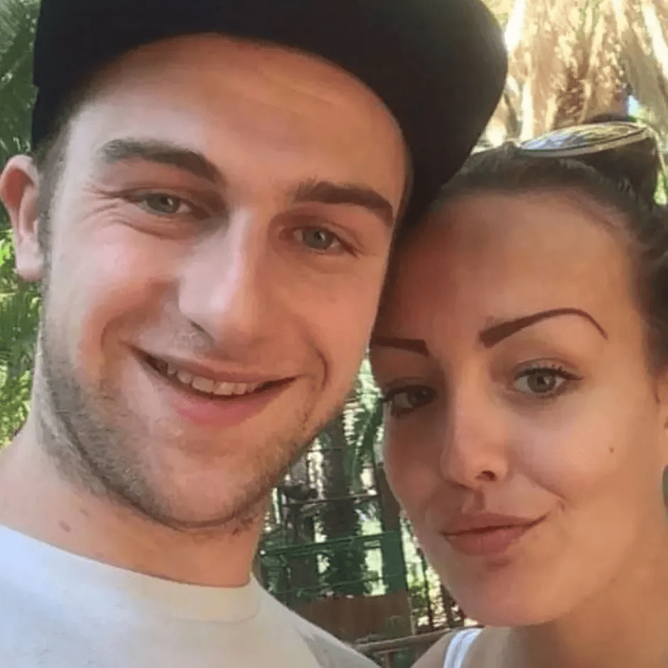 Close-up photo of a young couple smiling.