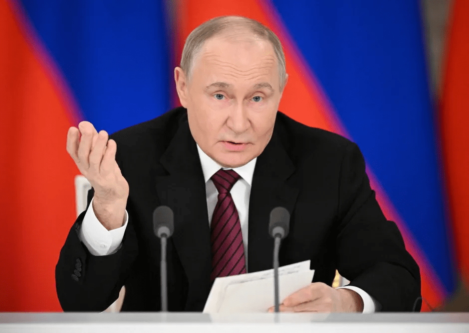 Vladimir Putin speaking at a press conference.
