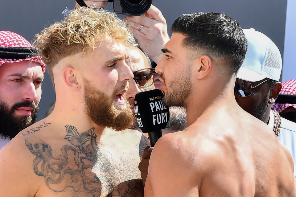 Jake Paul and Tommy Fury face off at a weigh-in.