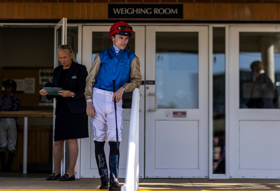 Jockey Kieran Shoemark outside the weighing room at Newbury Racecourse.