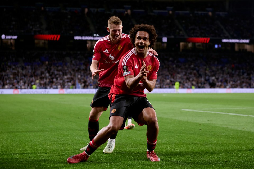 Manchester United players celebrating a goal.