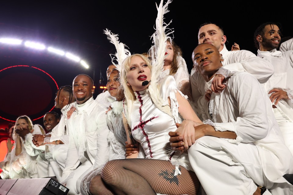 Lady Gaga performing on Copacabana Beach with backup dancers.