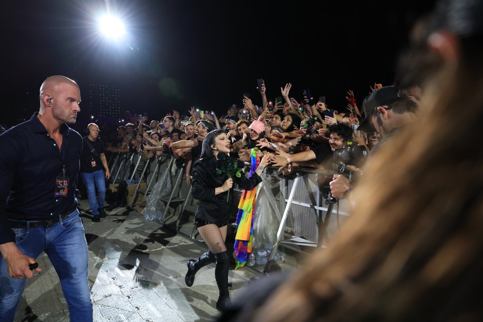 Lady Gaga performing at Copacabana Beach, interacting with the audience.