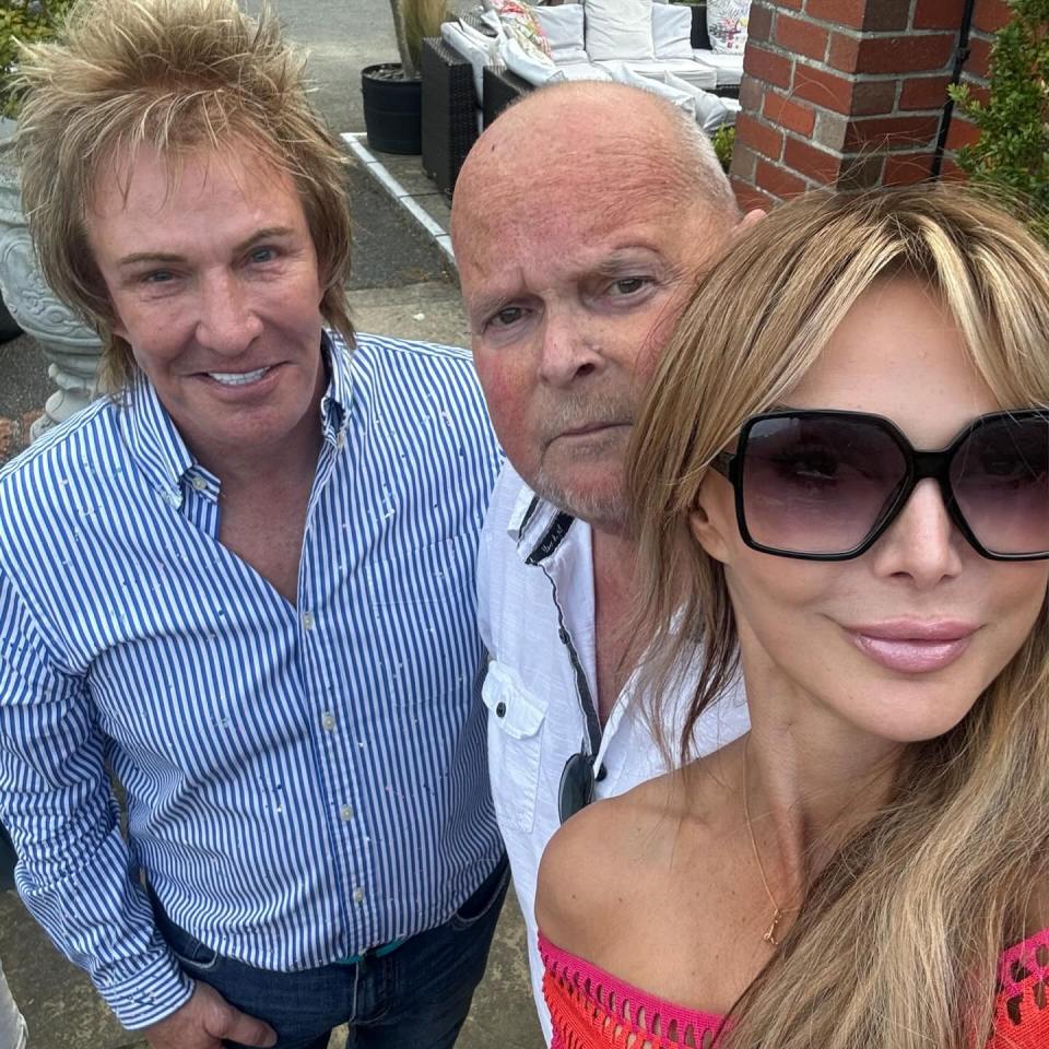 Three people posing for a photo.