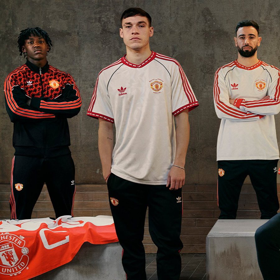 Three Manchester United players modeling the new Adidas kit.