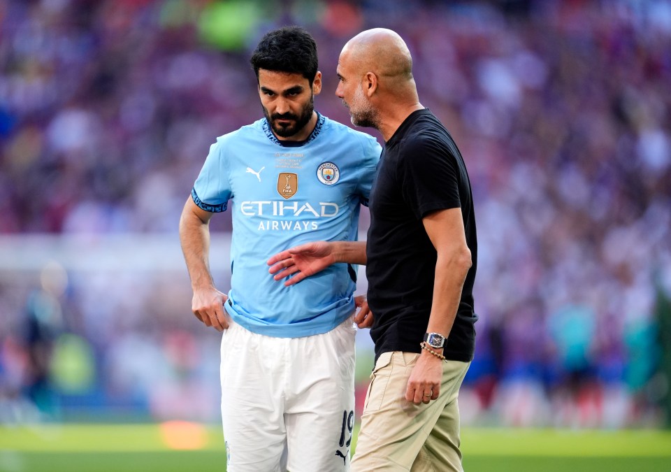 Ilkay Gundogan and Pep Guardiola after a soccer match.
