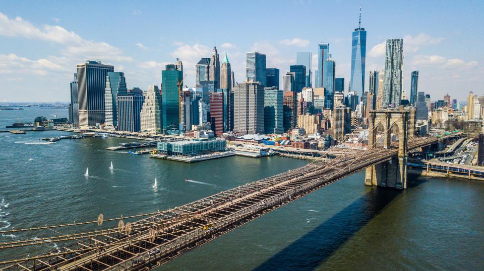 Aerial view of the Brooklyn Bridge and the downtown Manhattan skyline.
