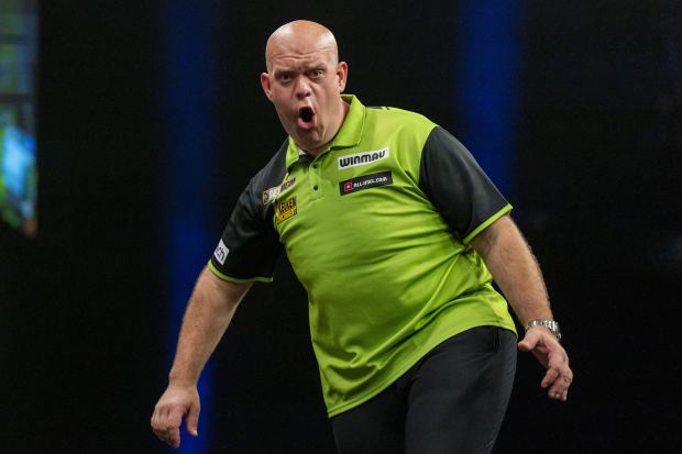 Michael van Gerwen reacting during a darts match.
